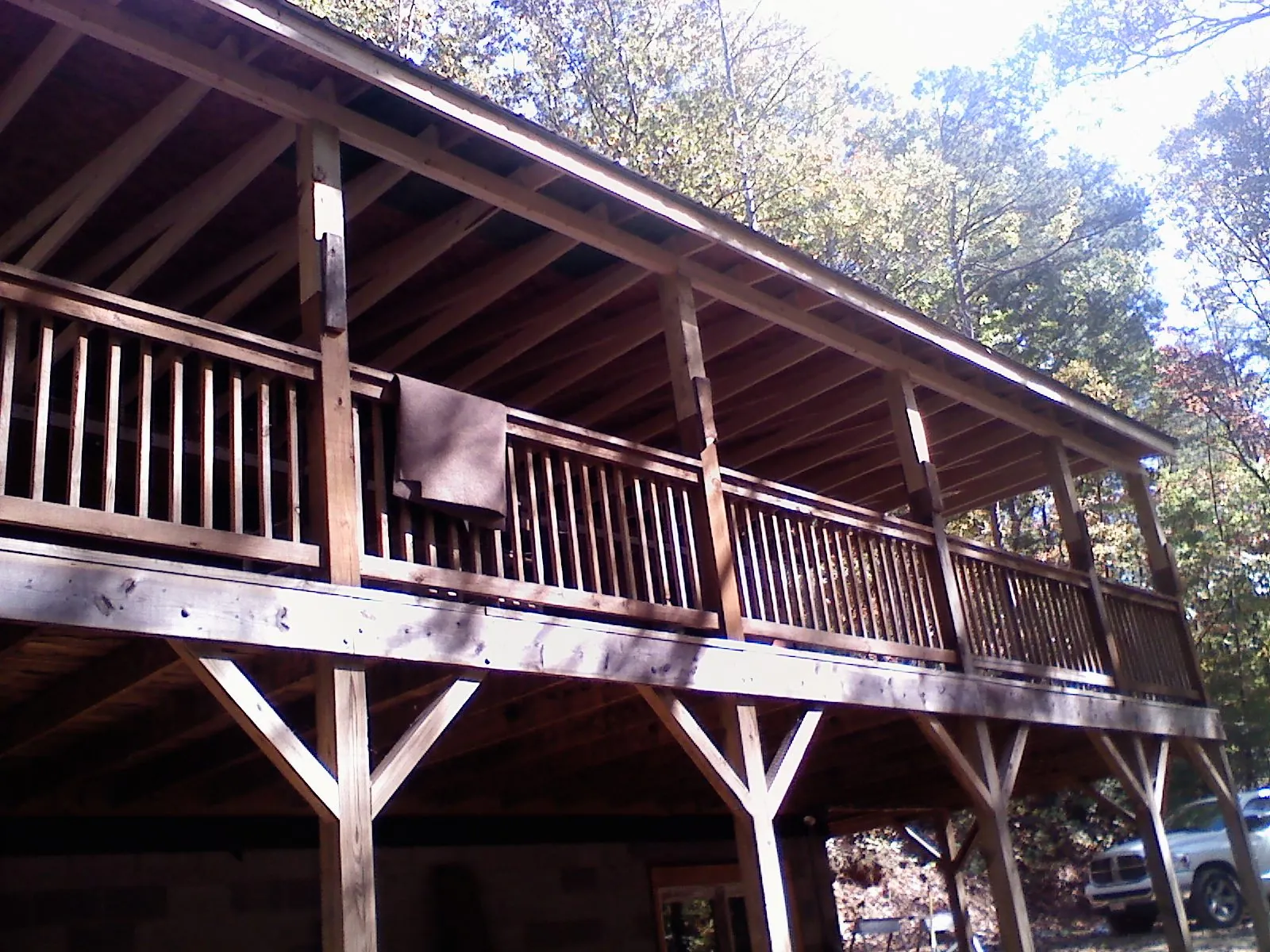 Timber framing under a new elevated porch and deck — Roof Leak Repair in Hollis by Roofing Brothers